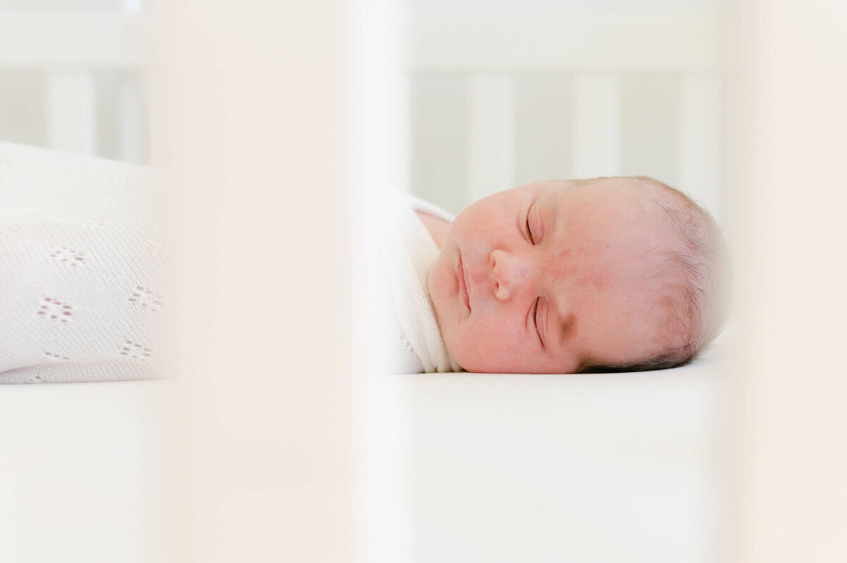 Lifestyle Bay Area newborn family photography in nursery with parents and baby.