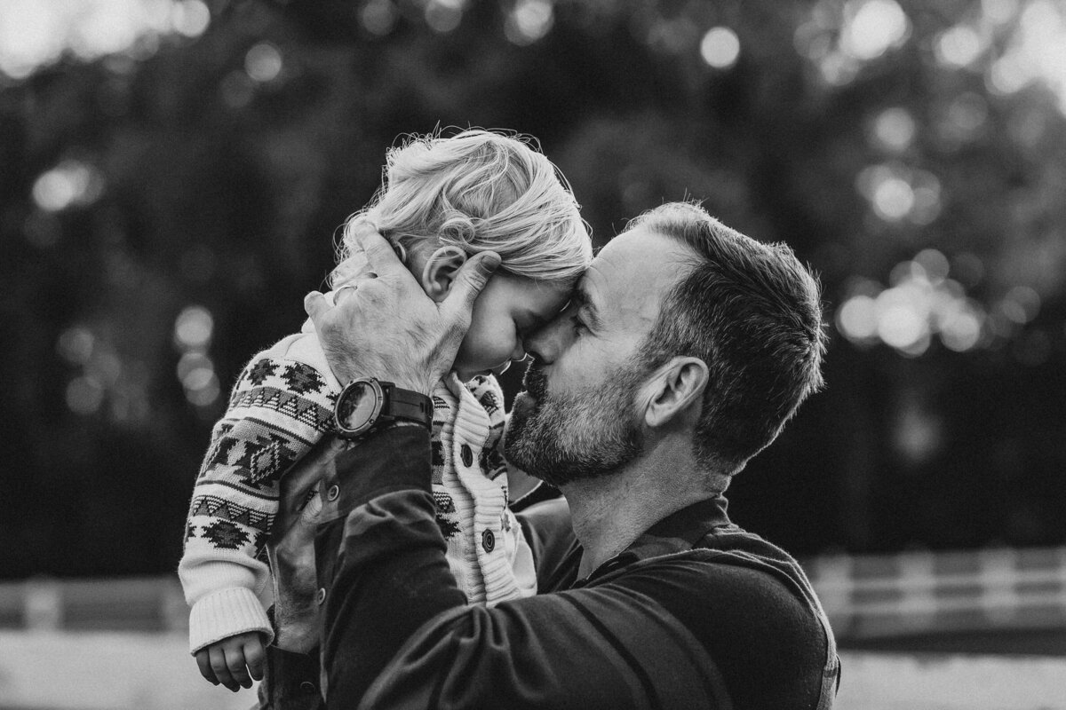father and son snuggle
