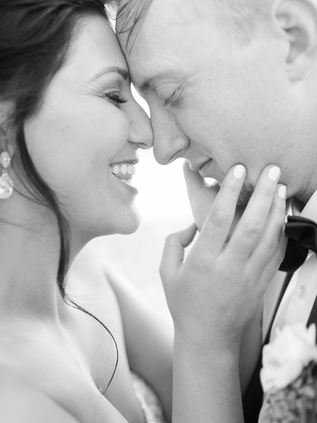 Bride and groom nose to nose