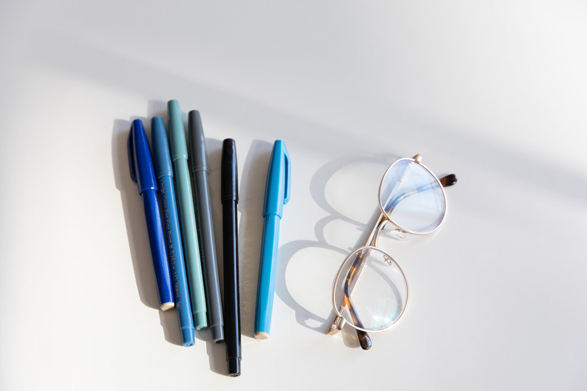 blue-pens-and-glasses