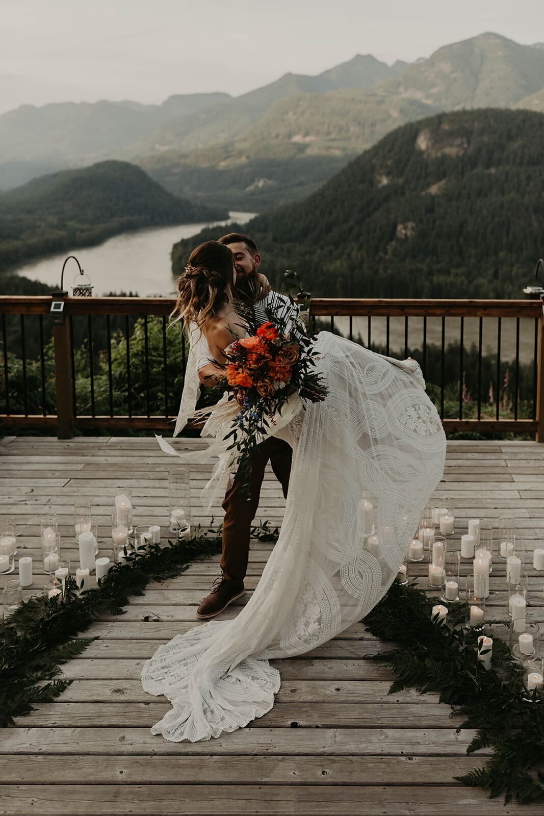 groom picks up bride