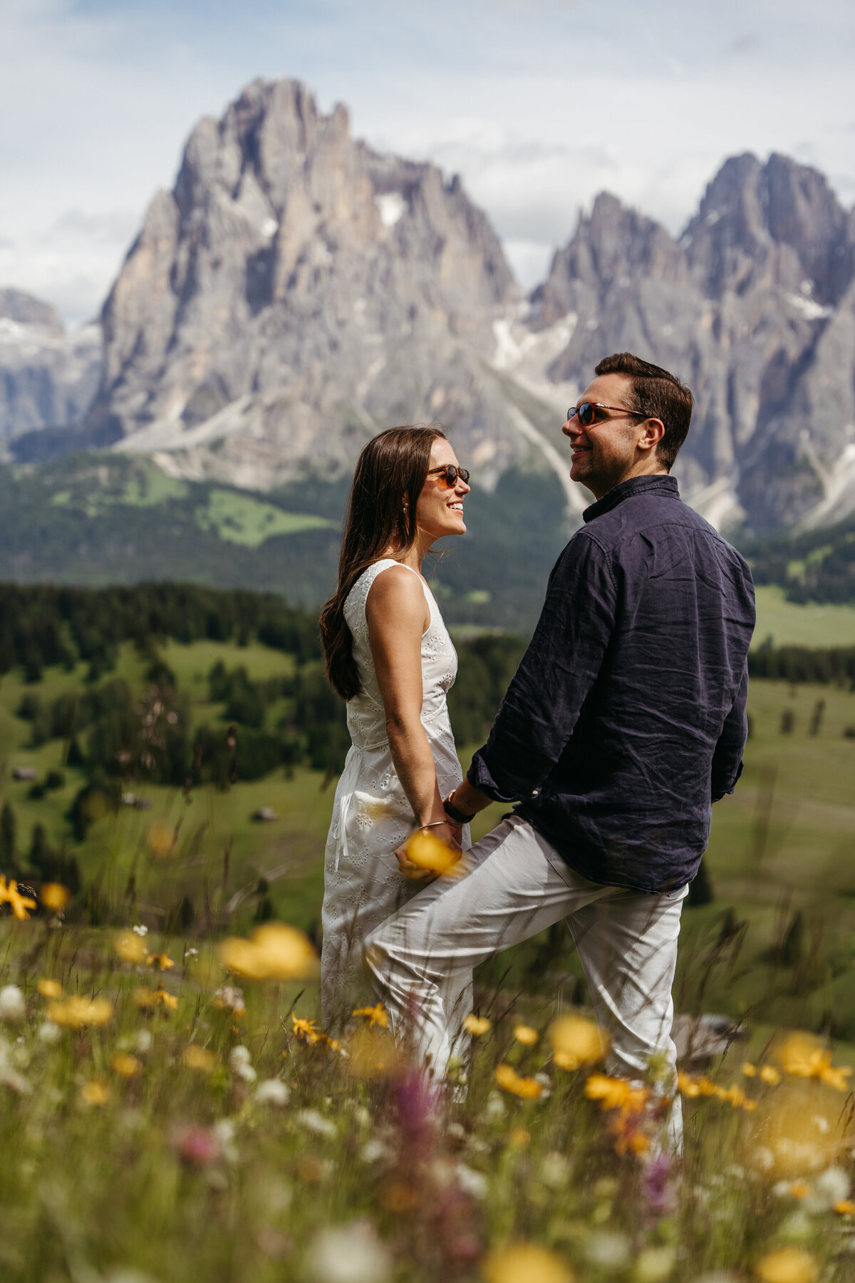 sweet couple intimate Alpe di Siusi mountain meadow view