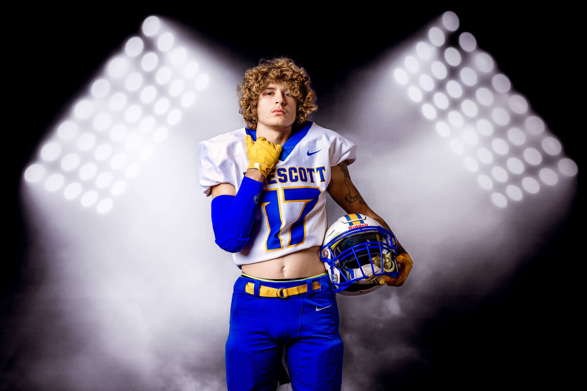 This Prescott High School football player poses in studio for Prescott senior photos