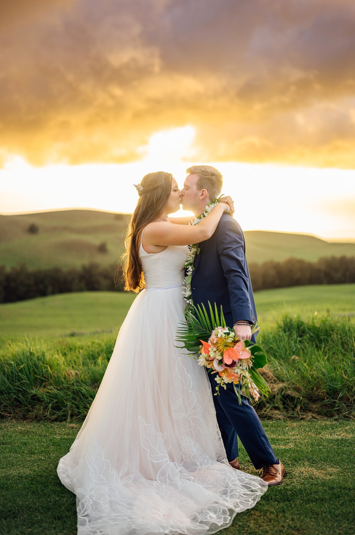 wedding kiss on the mountaintop at sunset