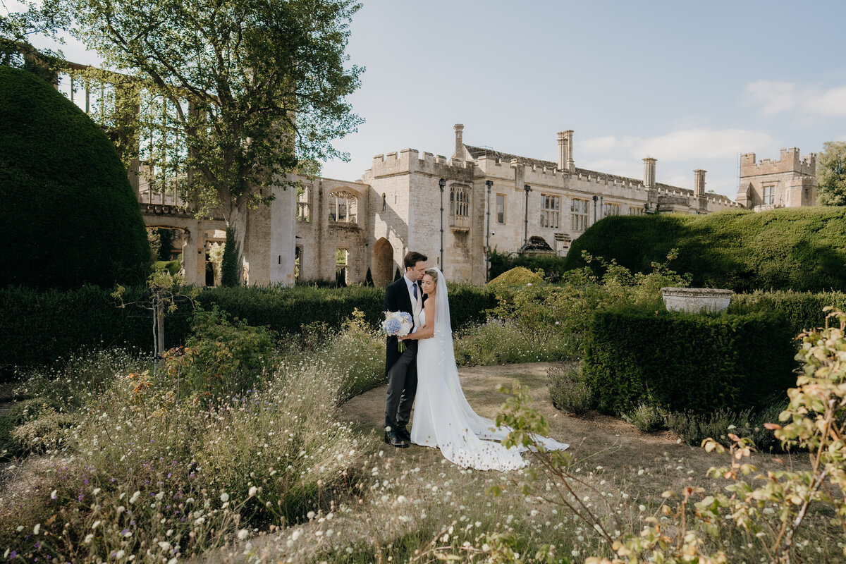 Sunset over the lake at primrose hill farm featuring a portrait of the married couple in suzanne neville dress