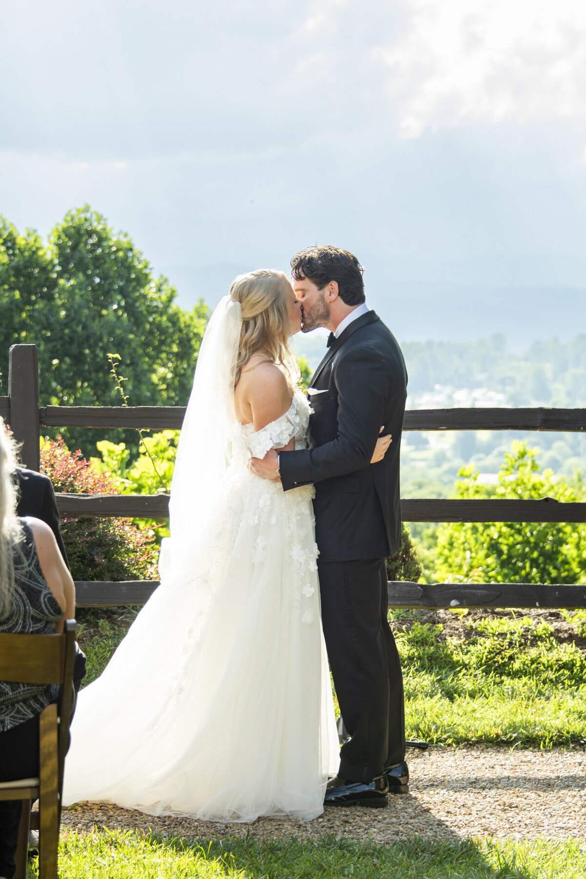 Wedding couple kissing at Crest Pavilion Asheville ceremony