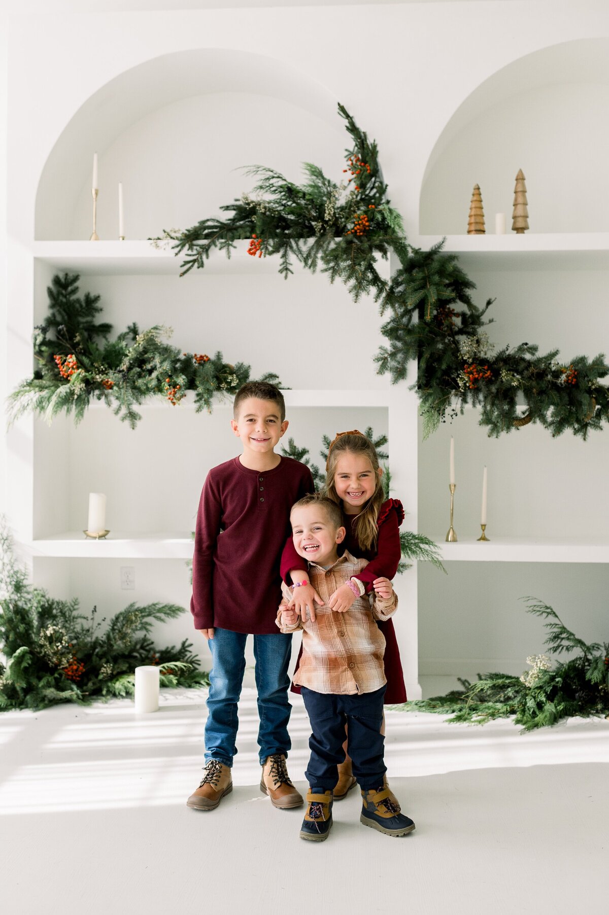 Happy kids with Christmas backdrop