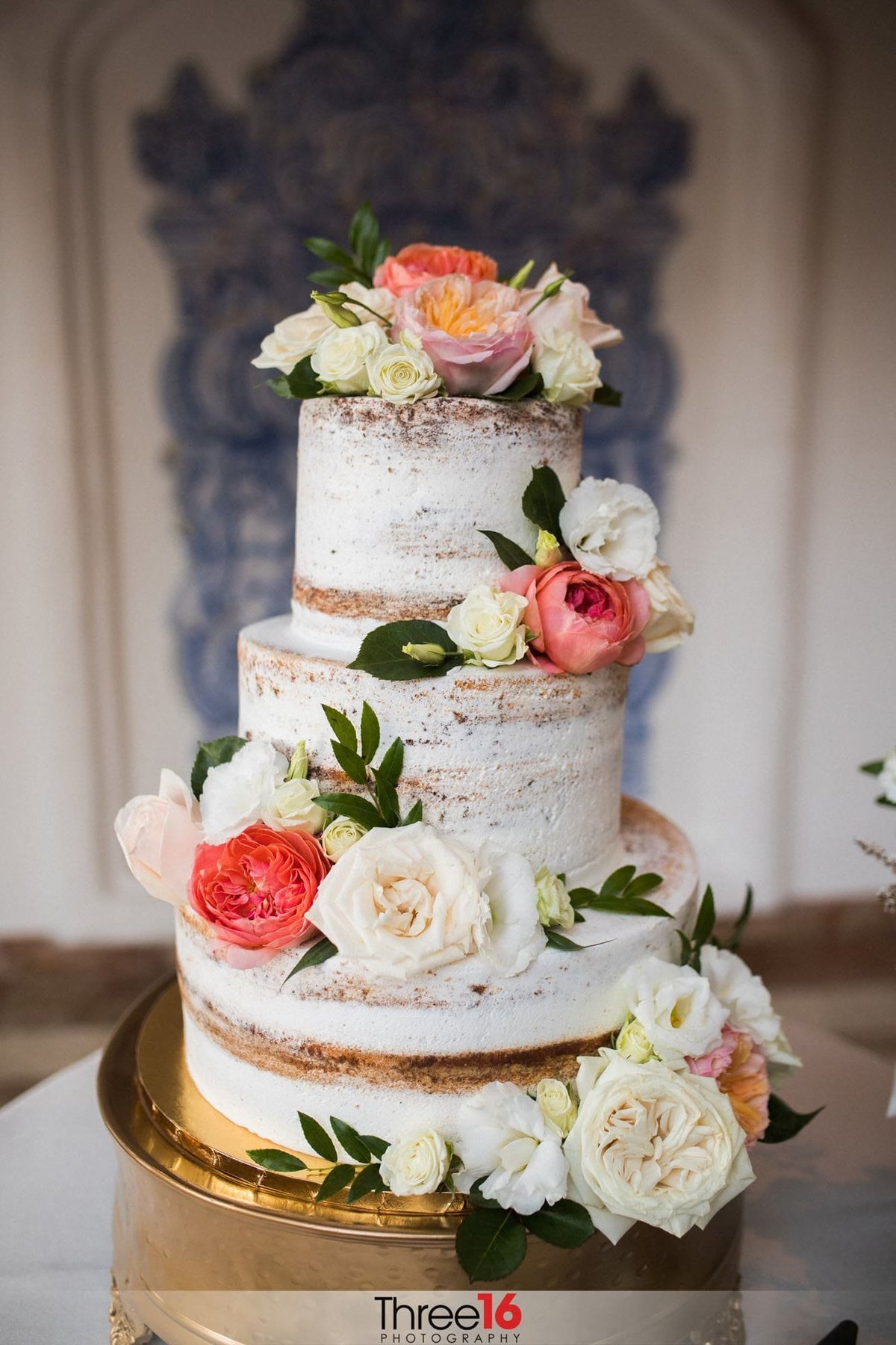 Gorgeous white 3-tiered floral naked wedding cake
