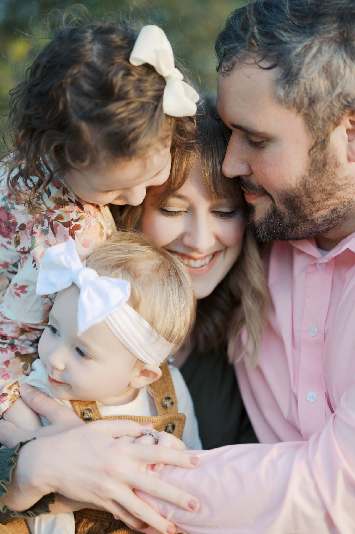 family snuggles close during dallas family photos in fall