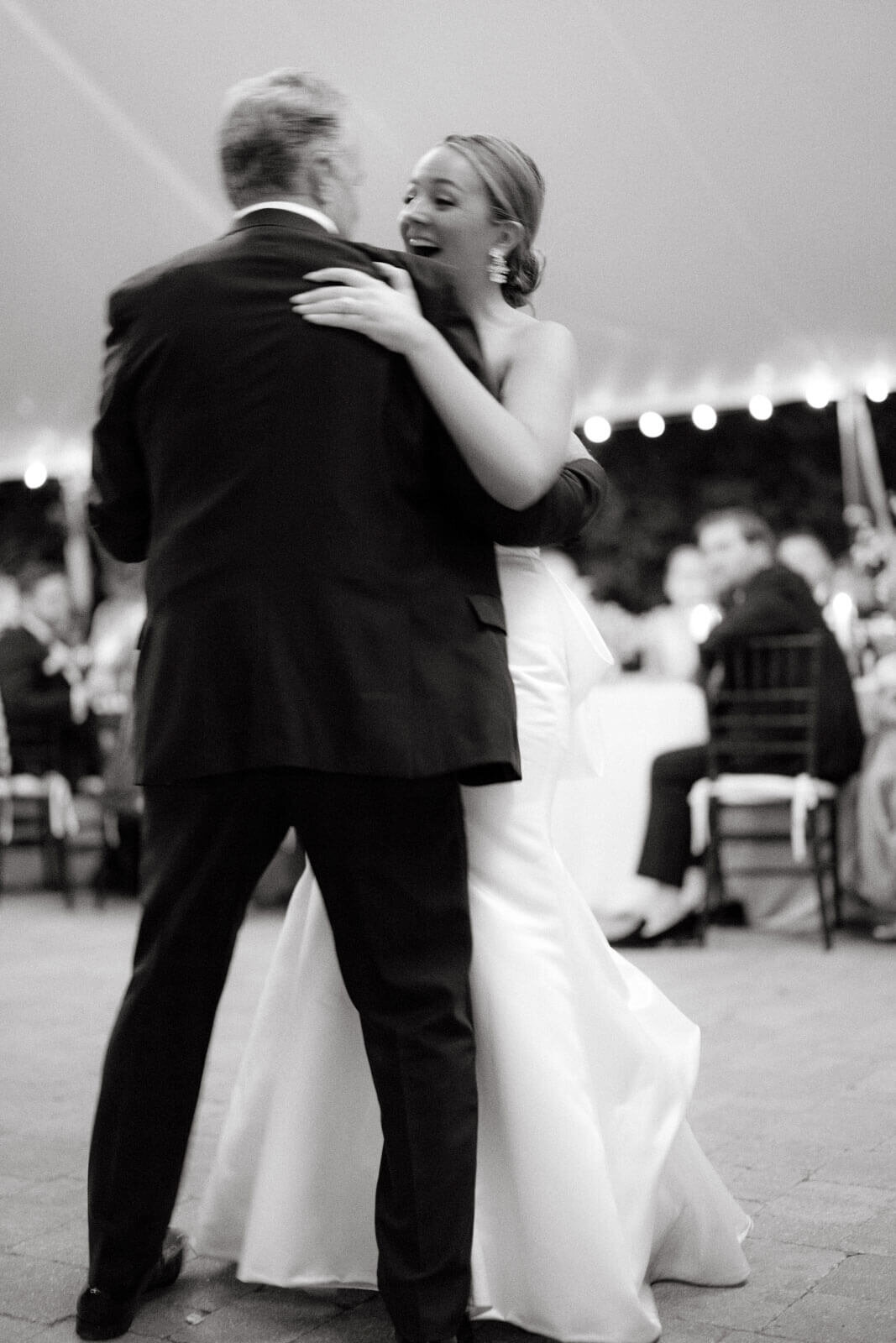 The bride is happily dancing with her father at the elegant wedding reception at Lion Rock Farm, CT. Image by Jenny Fu Studio