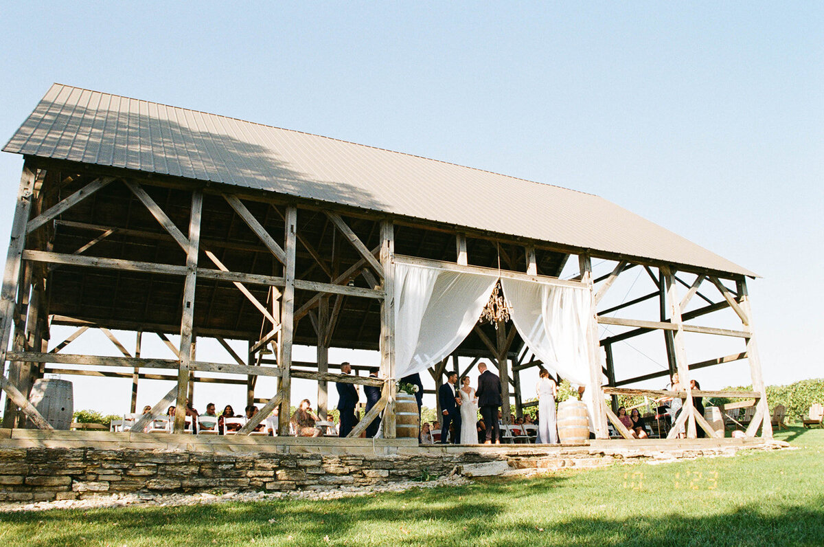 Wide angle image of a large wooden ceremony venue.