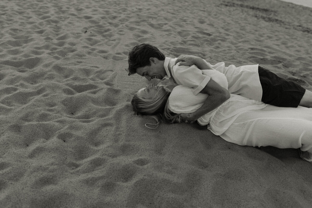 Playful beach engagement session in Northern Minnesota