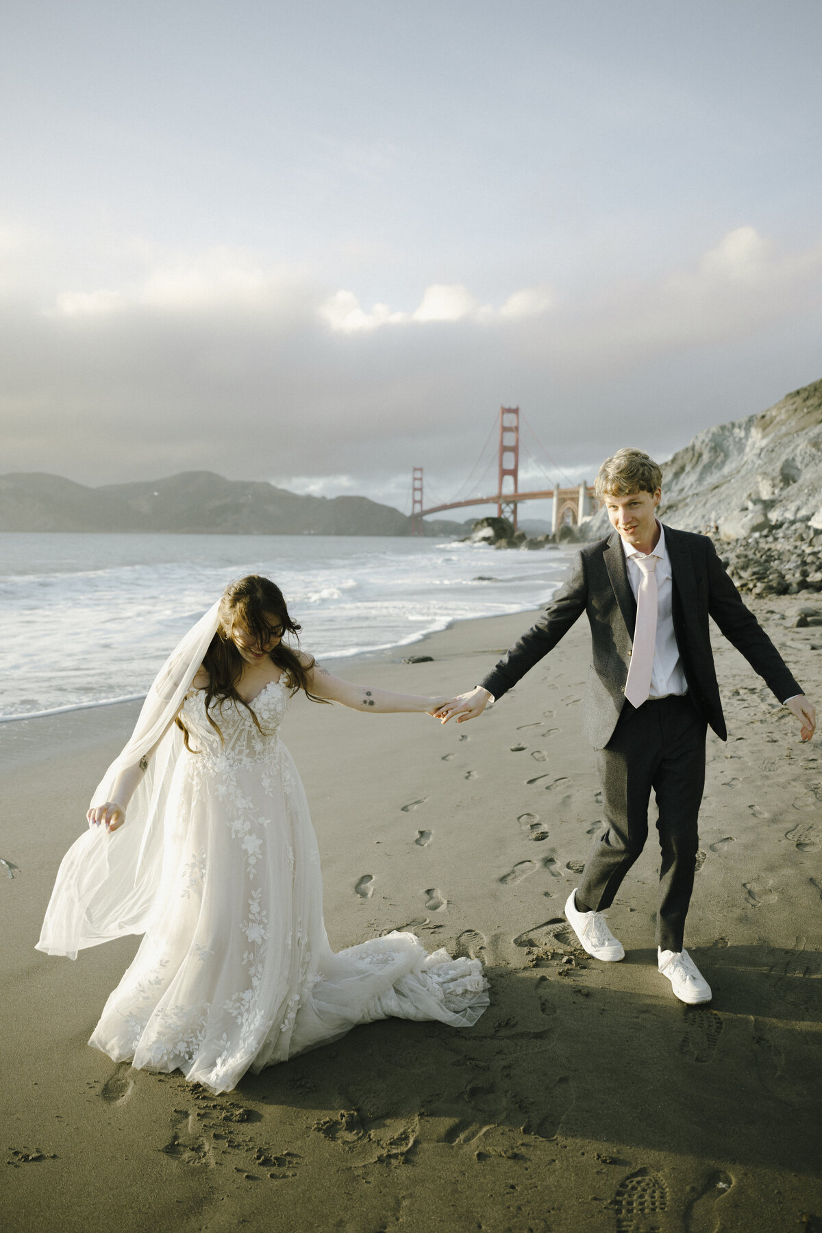 Bride and Groom at Marshall's Beach in San Francisco, California at sunset