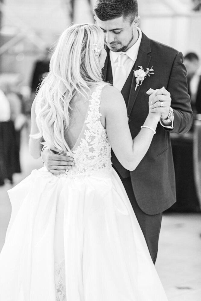 bride and groom slow dancing at wedding reception