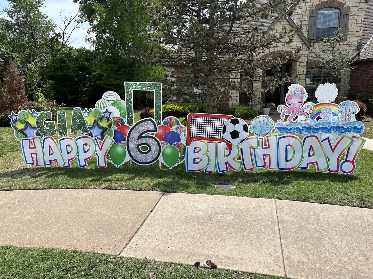 Custom birthday yard sign setup in Edmond, Oklahoma. Simply Sign It is a yard greeting rental company servicing Edmond, NW OKC, Piedmont, and Deer Creek. Order a yard greeting for birthdays, graduation, anniversary, back-to-school, and birth announcements. Design features  soccer, photo frames, and sea themes.