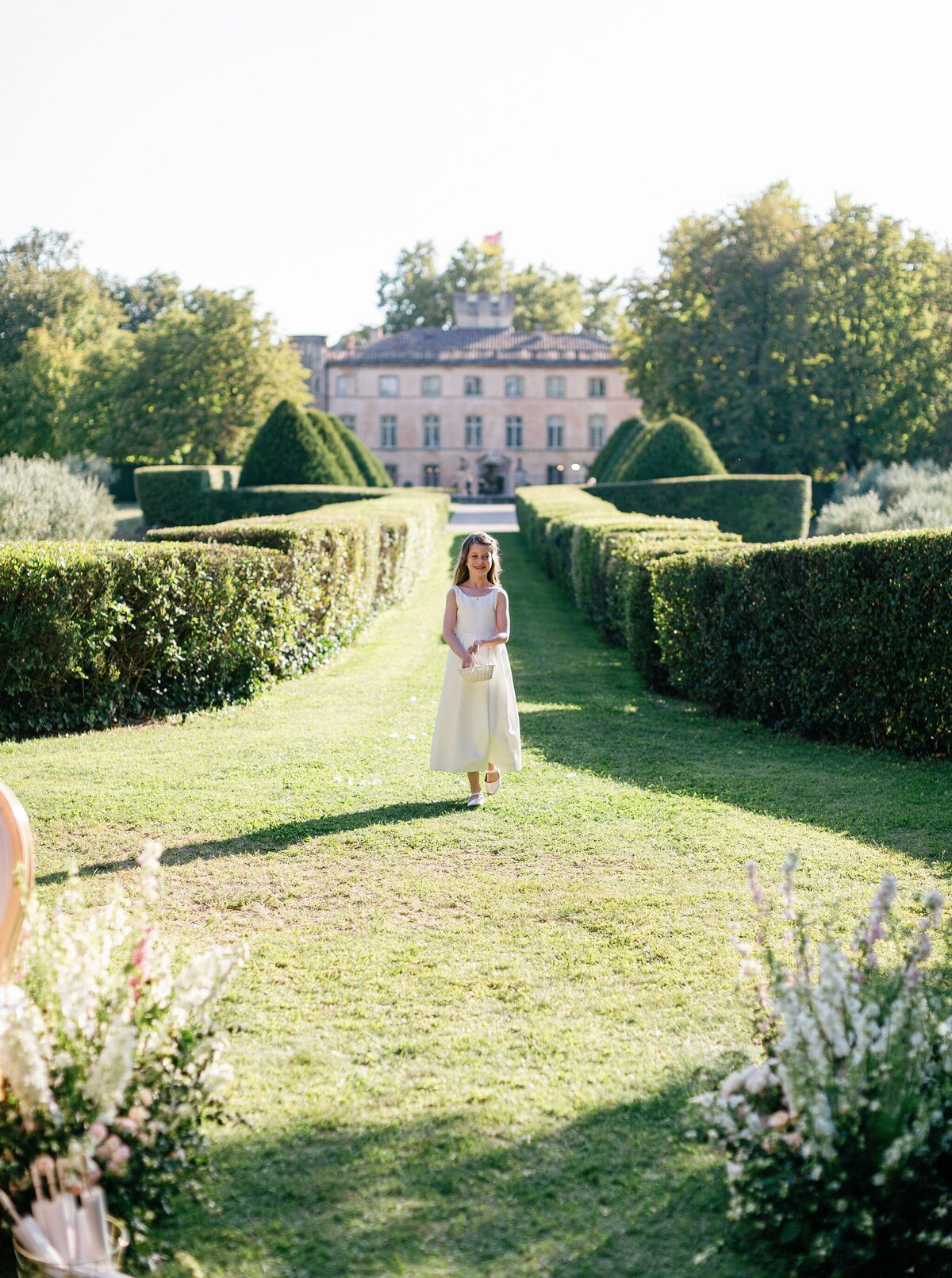 Flower-girl-wedding-aisle-chateau-France