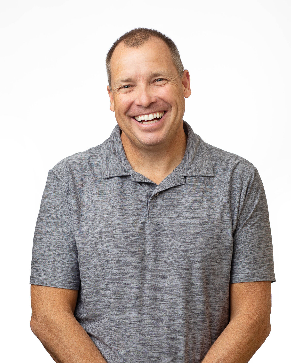 Smiling man in a gray shirt