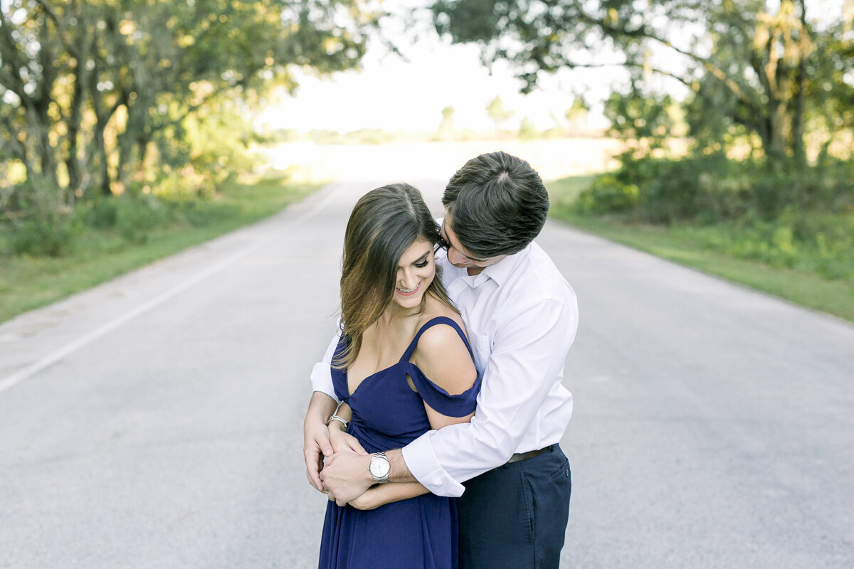 couple kissing in roadway