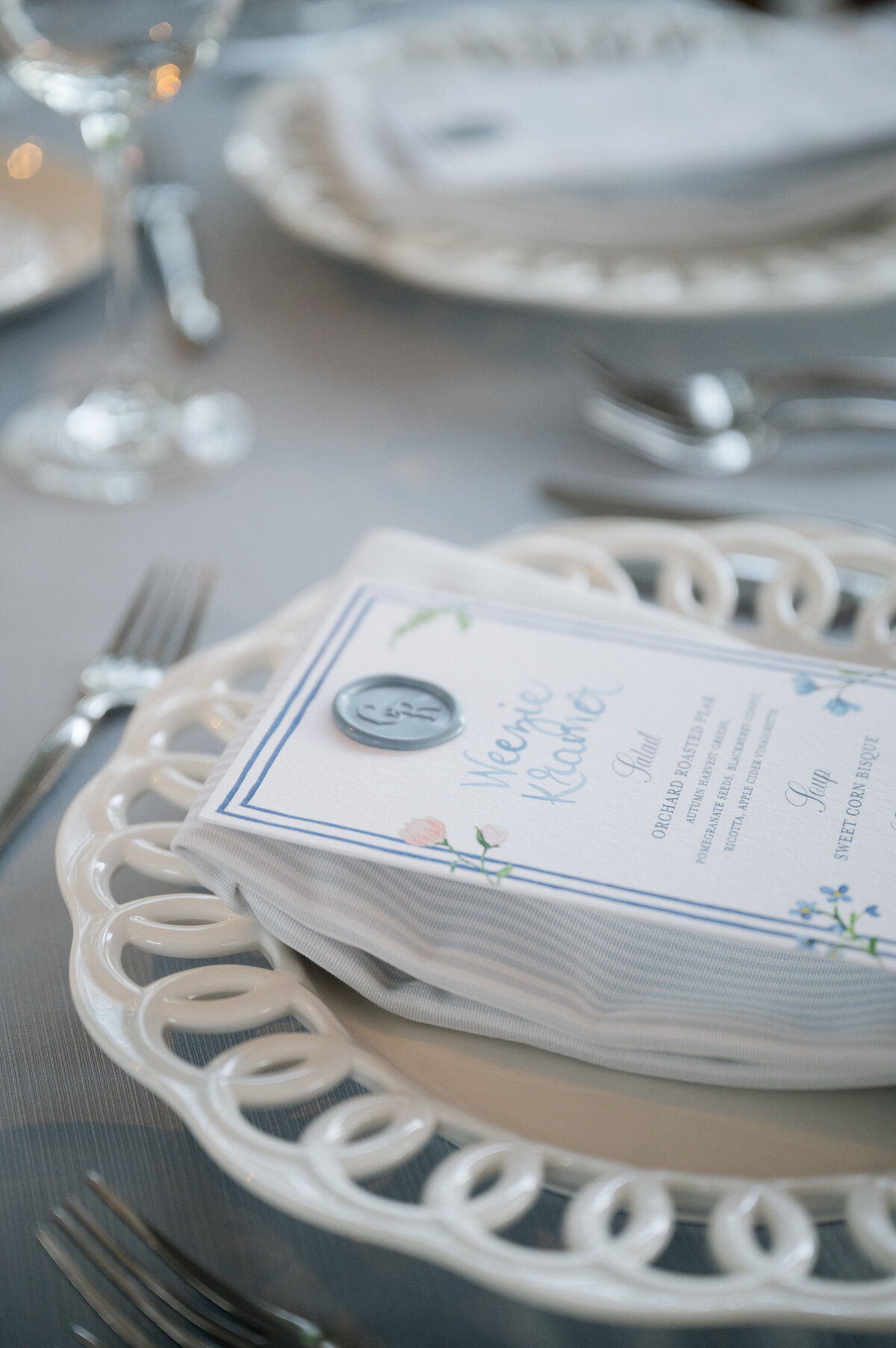 Close-up of a wedding menu and cutlery set on a table at the Chicago Botanic Gardens