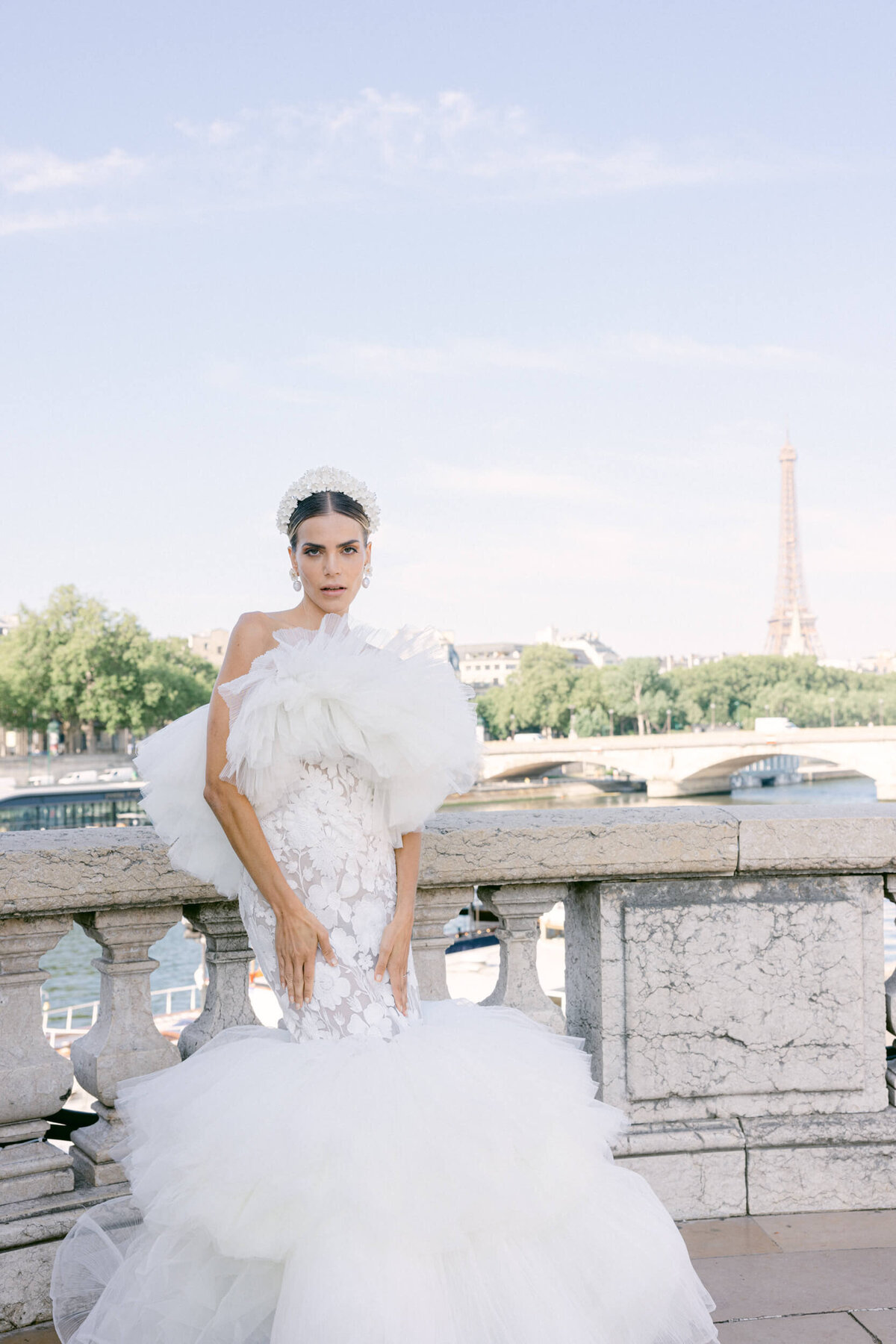 A wedding photo of a bride in her white dress in the streets of Paris in France.