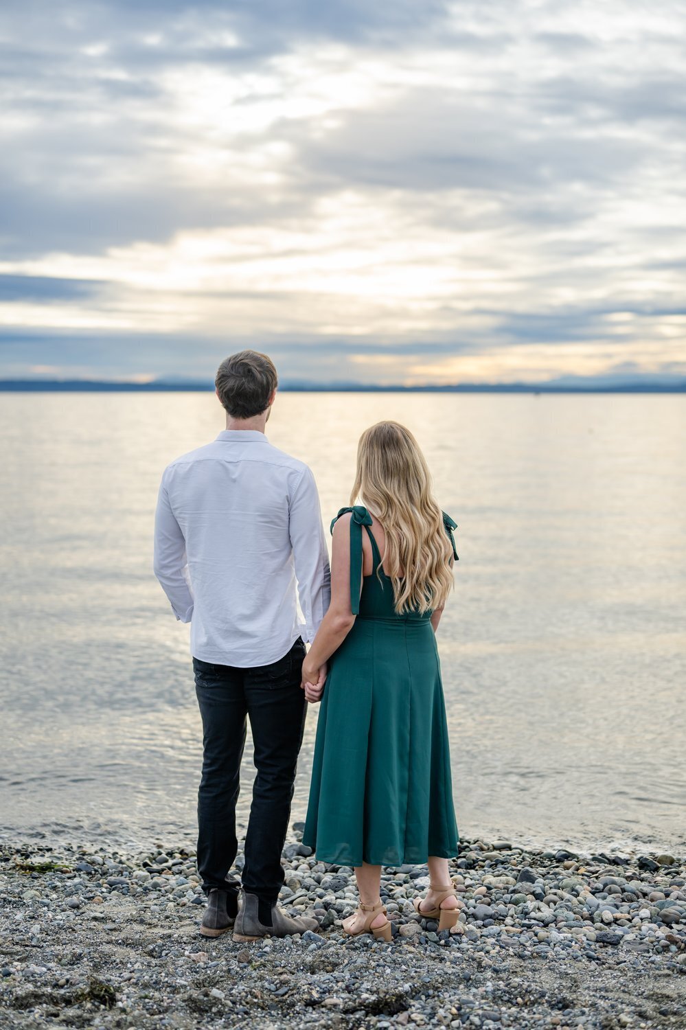 man and woman looking at pnw water