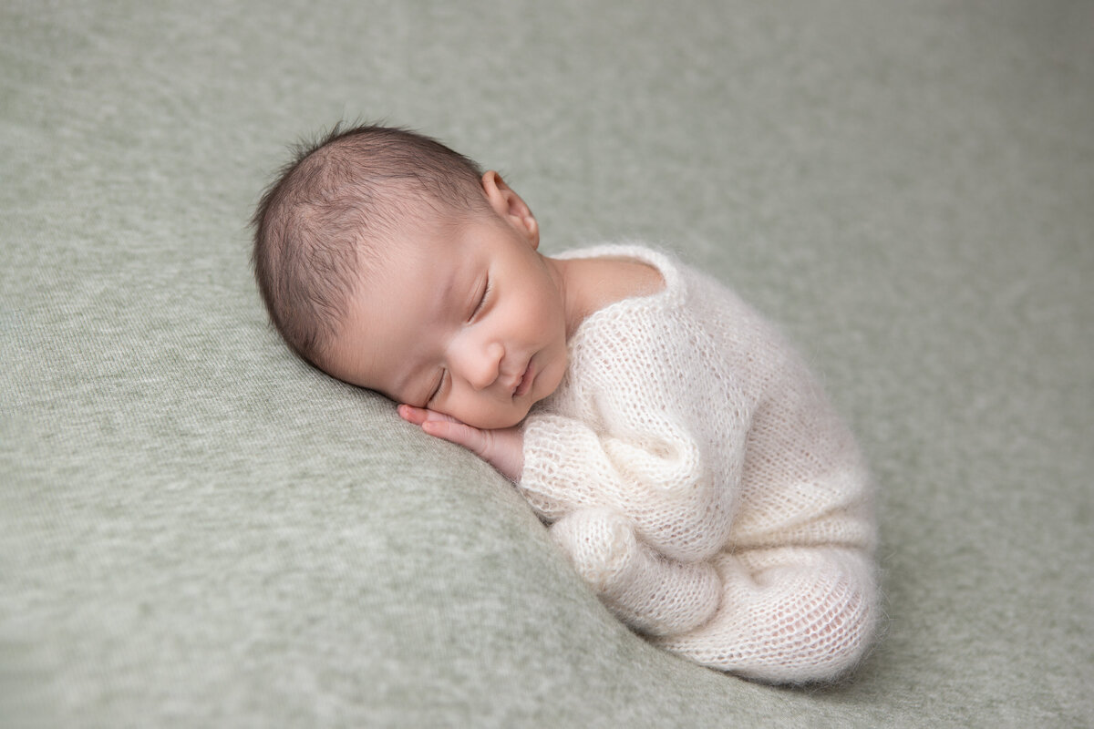 Edmonton studio newborn table taco pose or womb pose pastel green backdrop