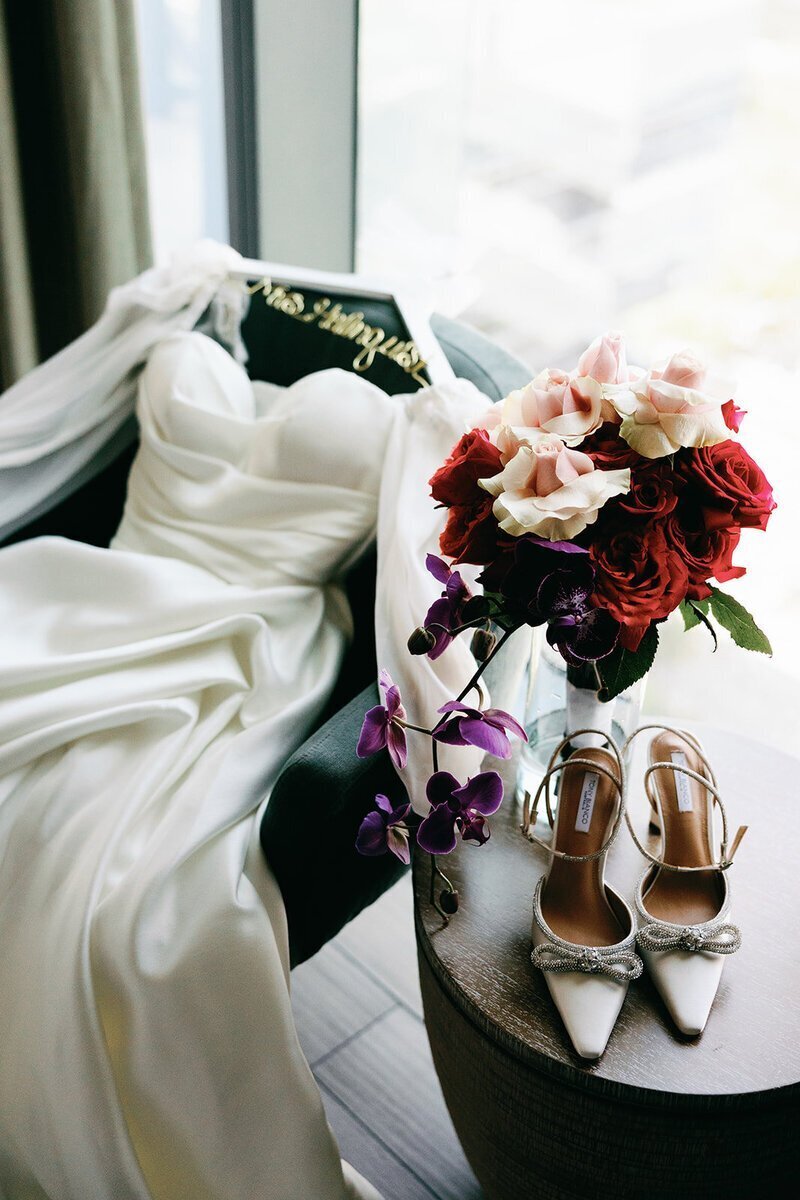 penthouse at riverside wharf photos of wedding details including dress, shoes, and flowers