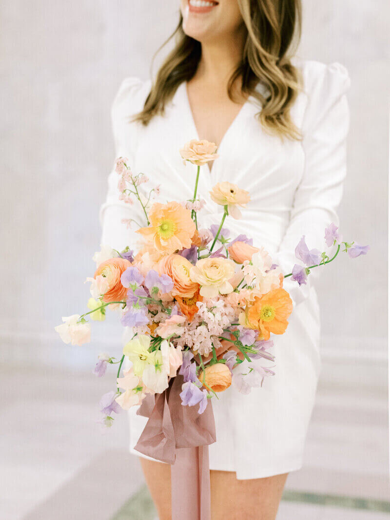 Bride holding bouquet at wedding by wedding planners chicago