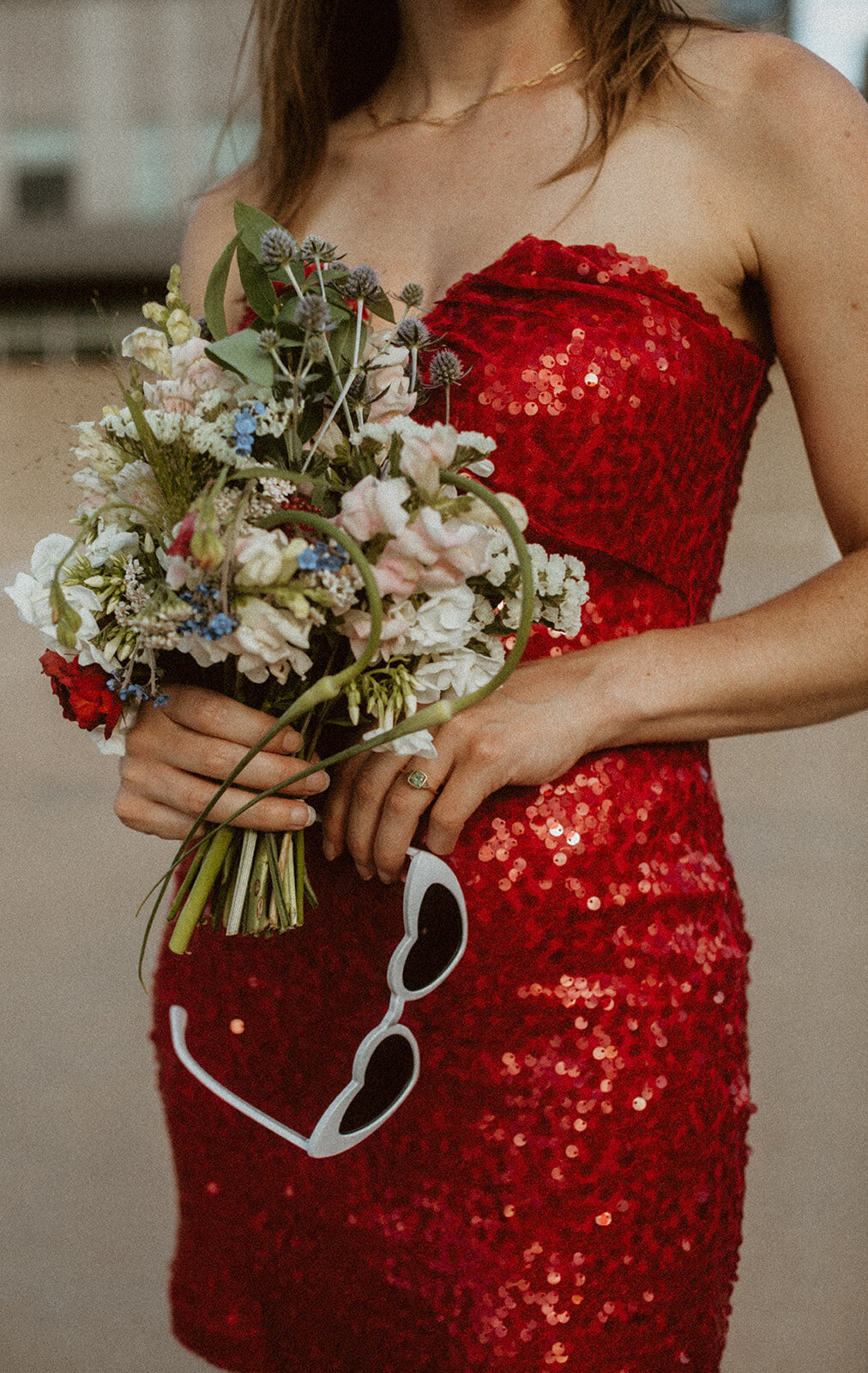 parking garage elopement with red wedding dress