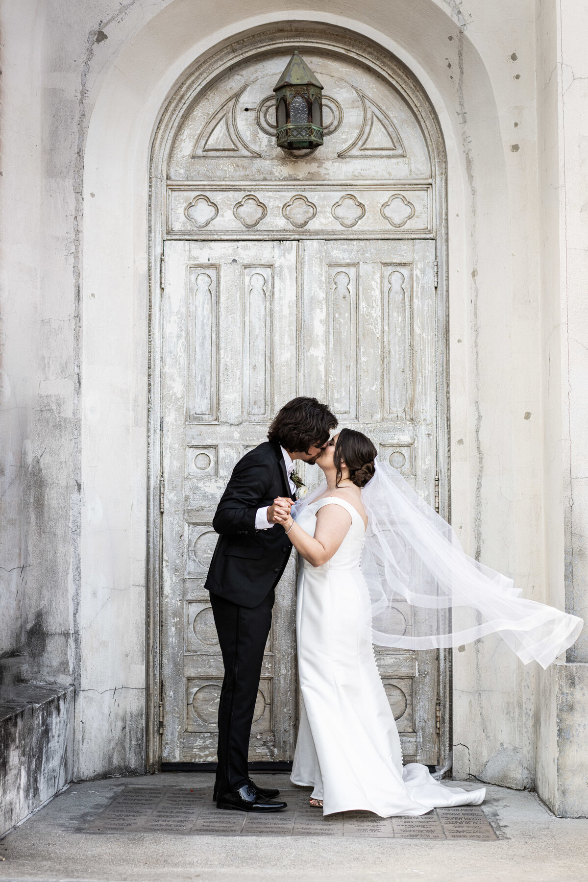 Bride and groom in doorway at Hotel Peter and Paul wedding