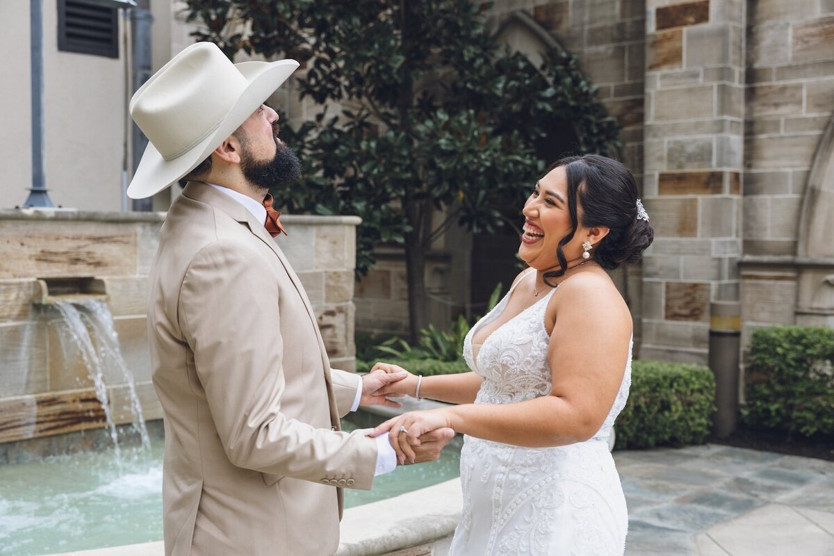 Bride and groom laughing during outdoor portraits