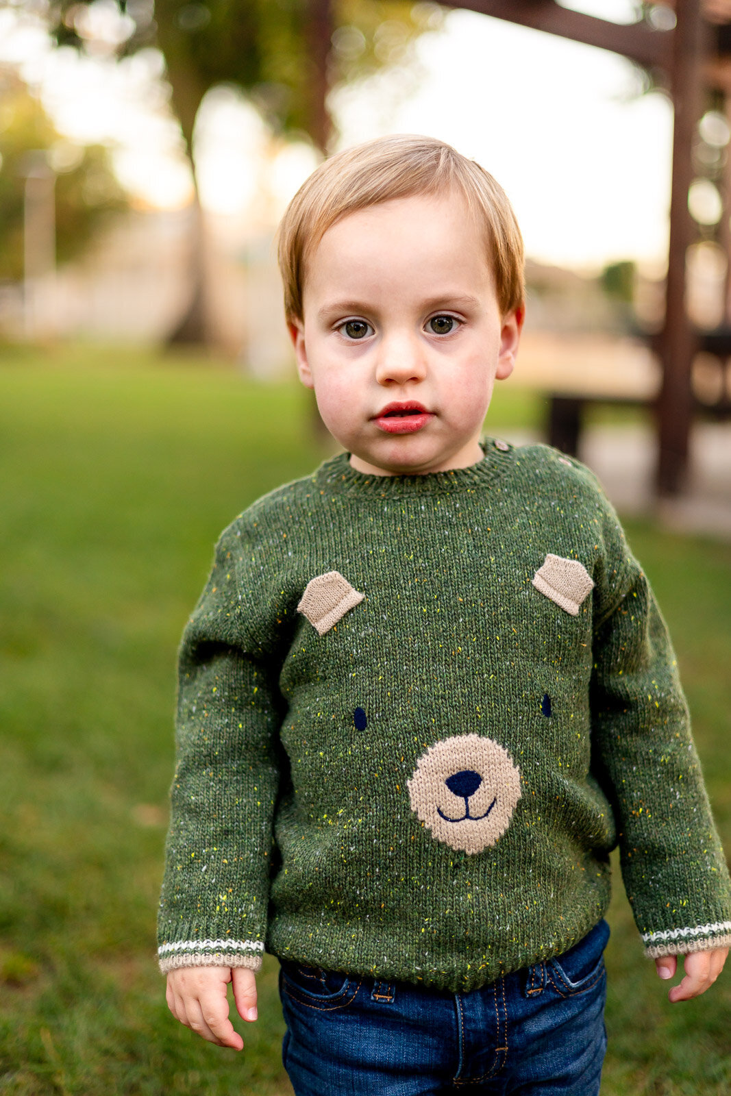 Toddler in green bear sweater during outdoor session – Bay Area Family Portfolio by Ellobelle Photography