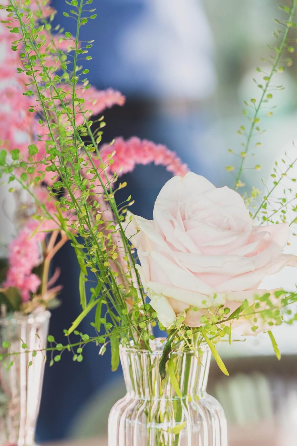 Small floral display in a glass vase