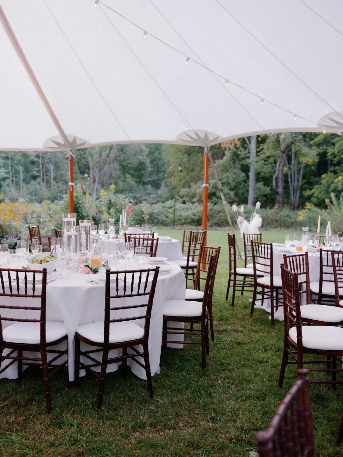 Elegant tented reception at private estate wedding.