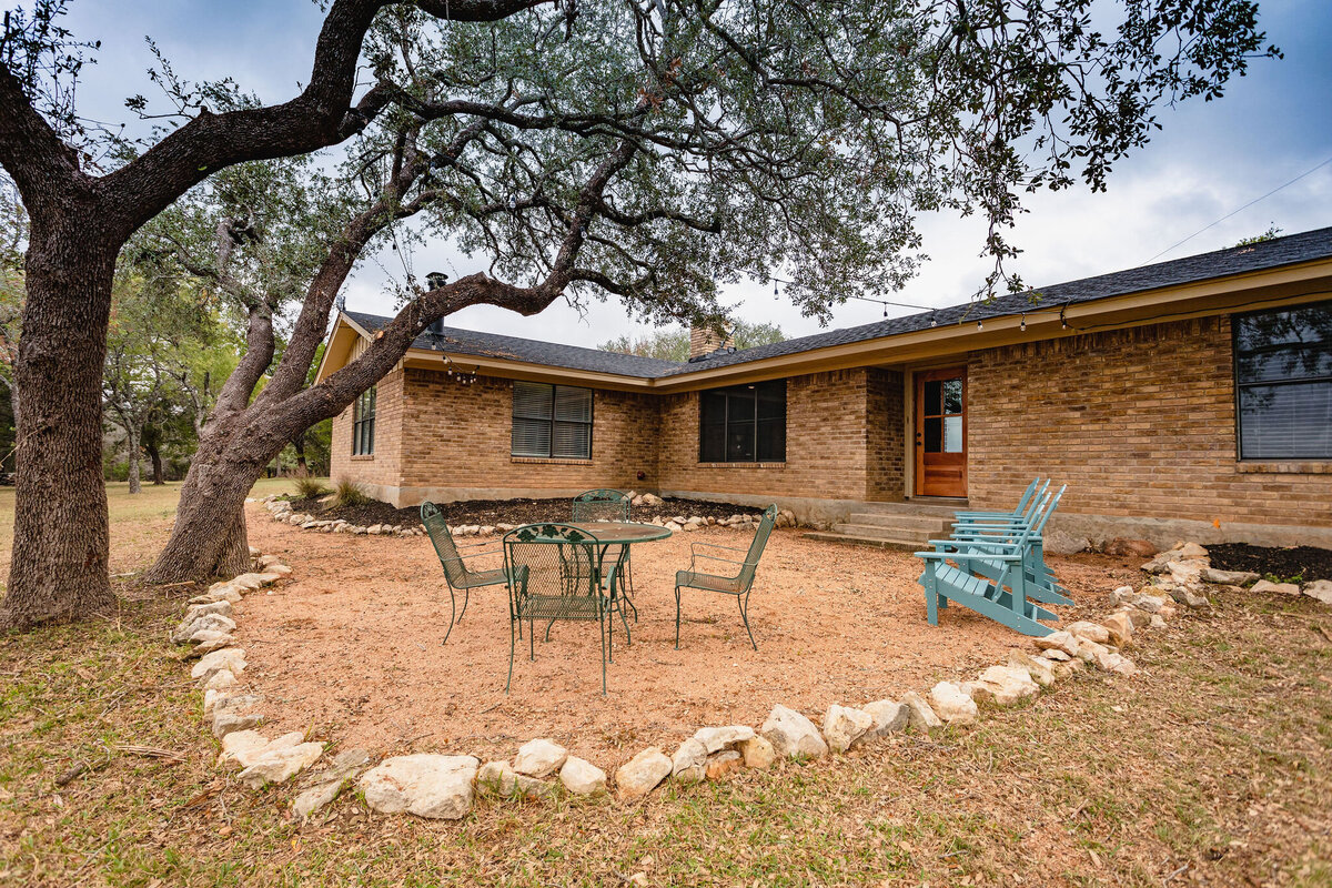 Back patio area with plenty of outdoor seating at this three-bedroom, two-bathroom ranch house for 7 with incredible hiking, wildlife and views.