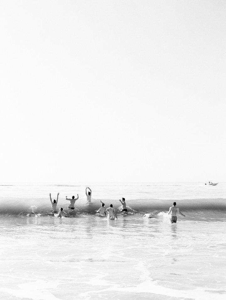 groomsmen on the beach before getting read photos for a wedding