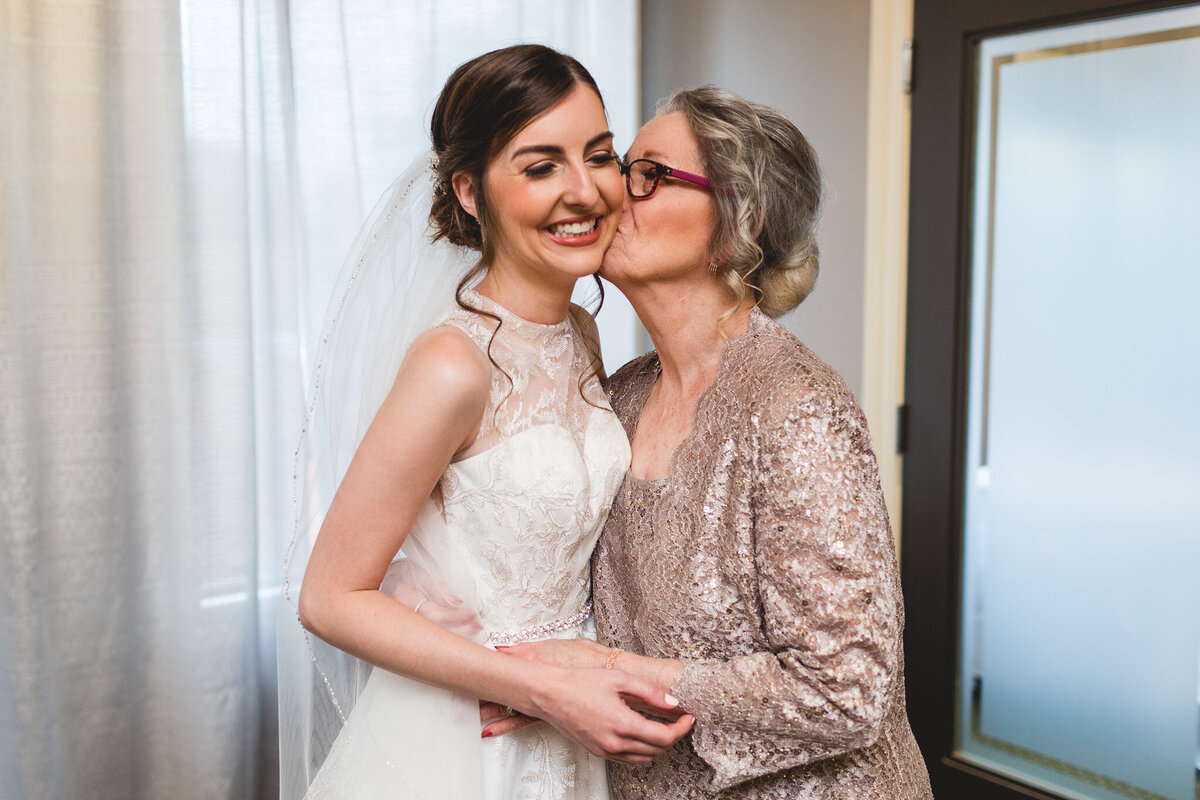 bride with grandmother sharing a kiss ohio wedding