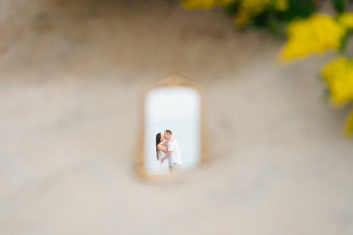 Romantic coastal engagement session in New England overlooking the shoreline.