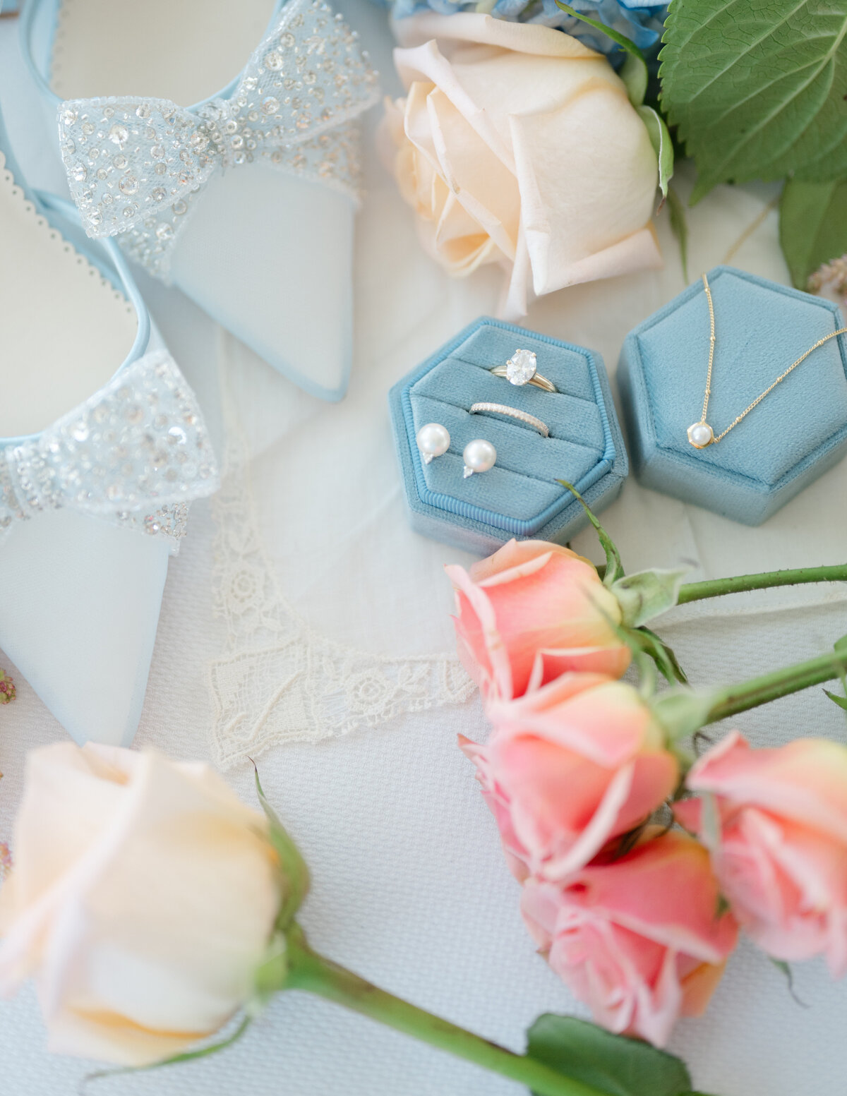 A photo of the brides details with light blue shoes and pink roses at a wedding on Mackinac Island