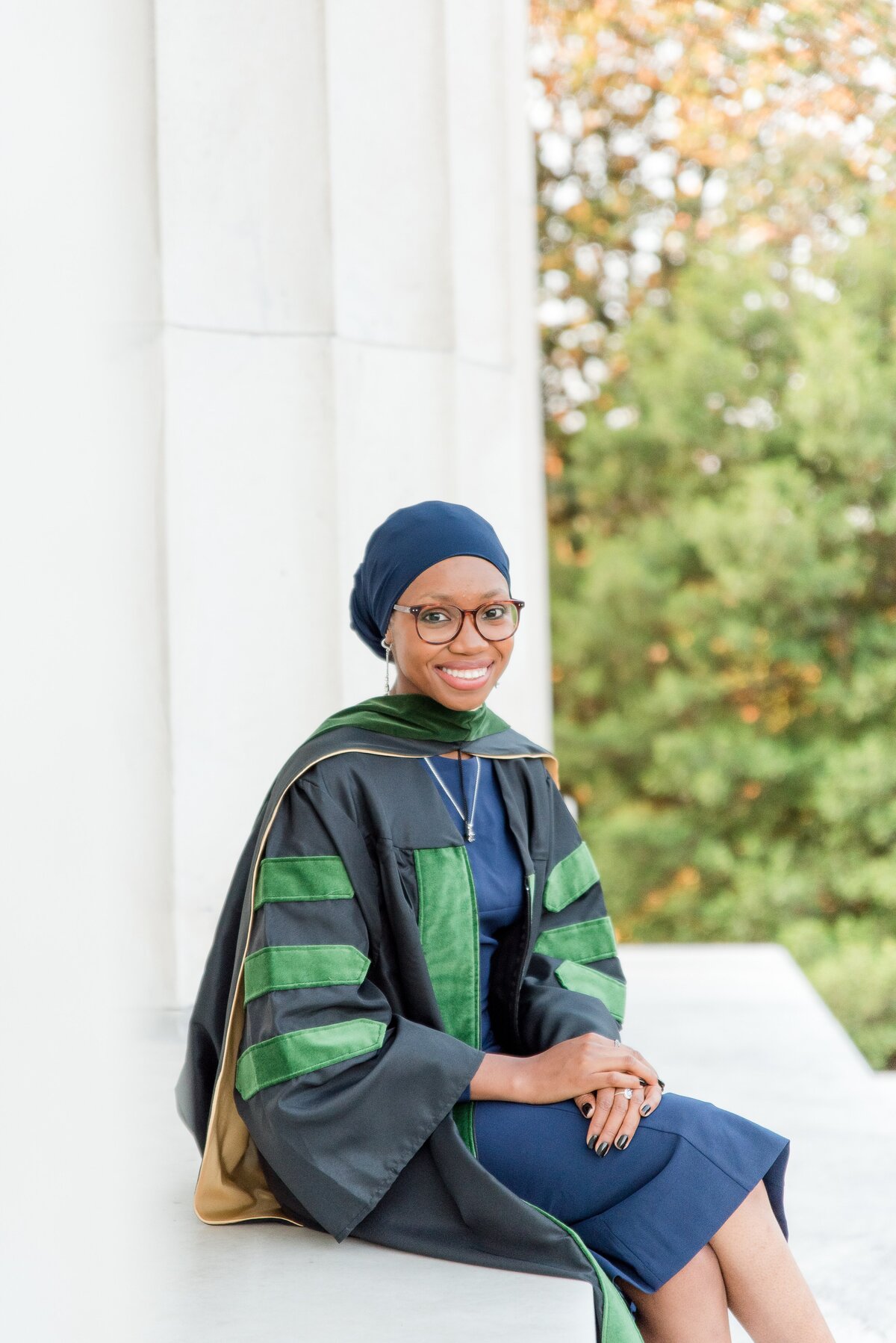 female grad med student sitting on marble steps lincoln