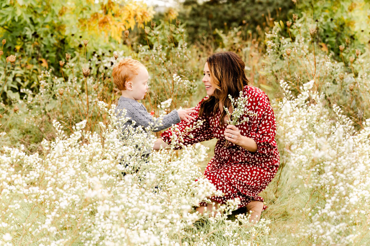 Mother in a field of wildflowers with her son near Naperville, IL.