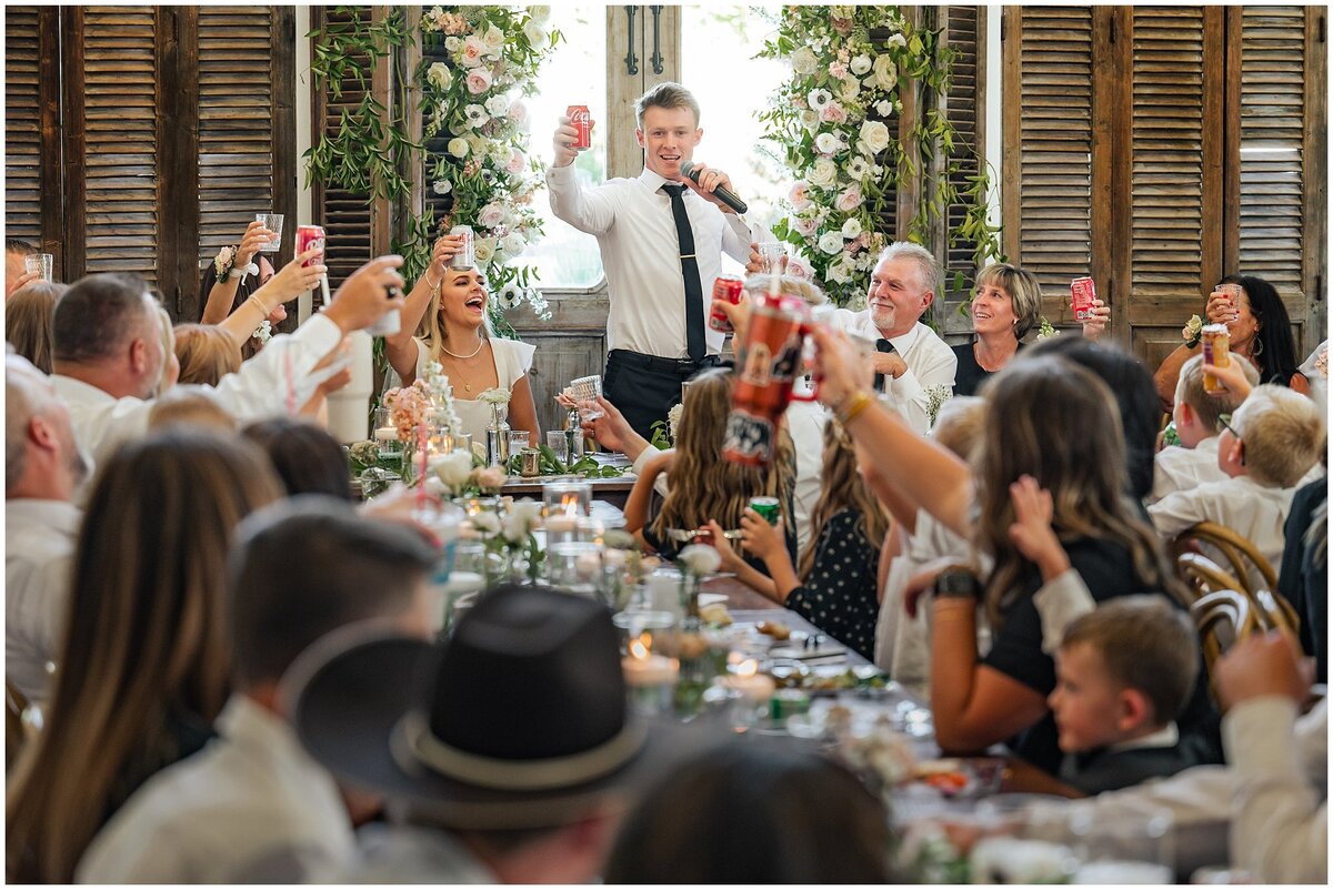 Wedding toasts happening inside Walker Farms barn.