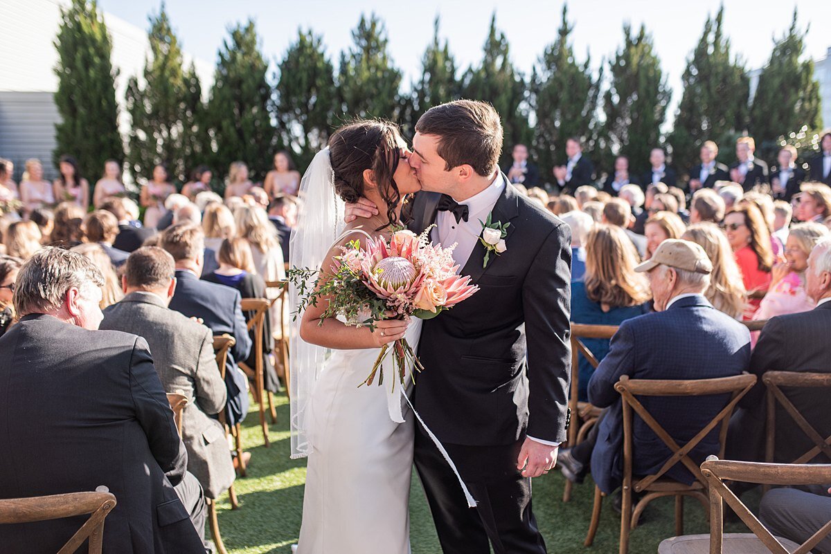 Bride-groom-wedding-greenville-sc-avenue-rooftop-garden-kiss