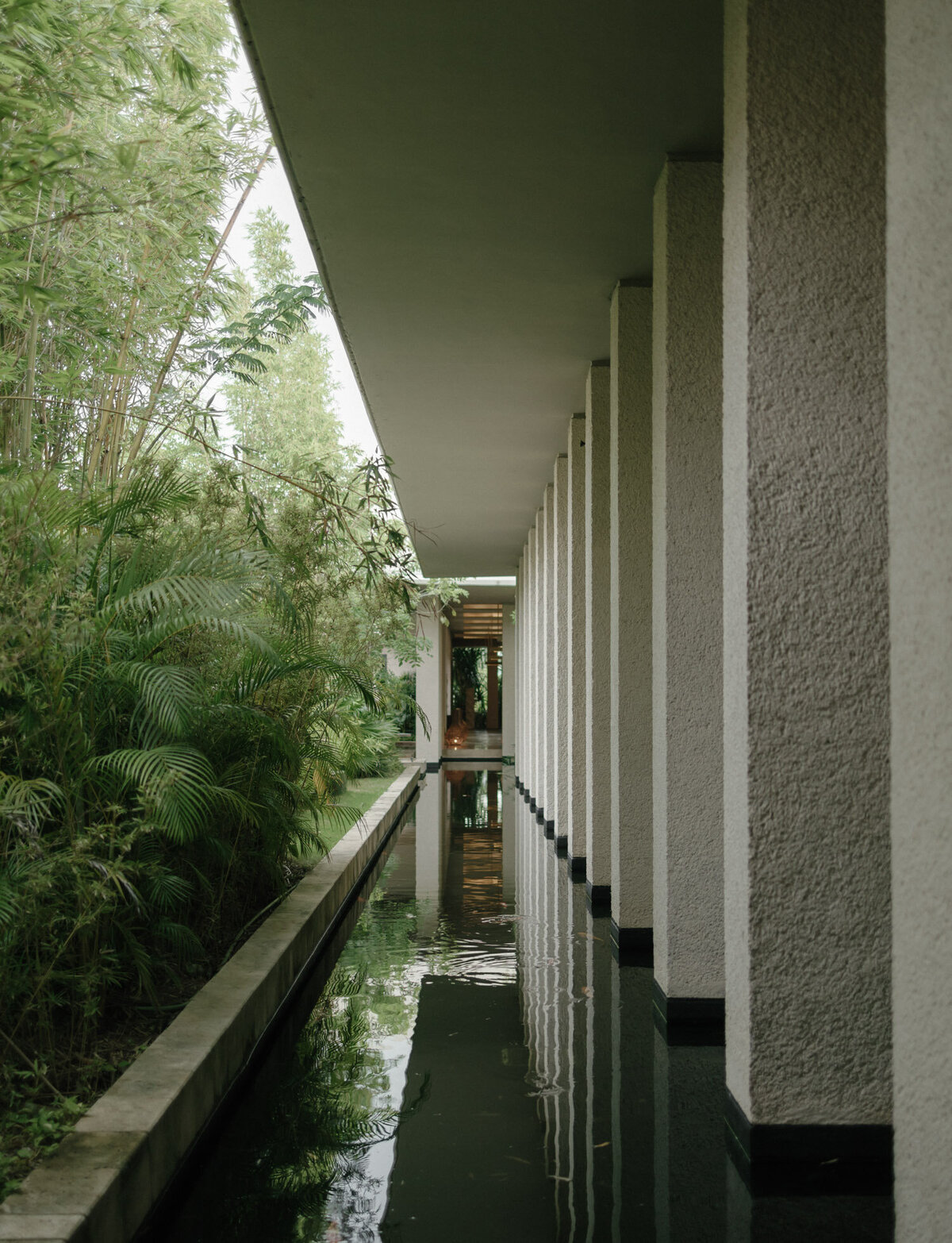 stunning architecture and design with lush green and koi pond at Paradisus Playa del Carmen