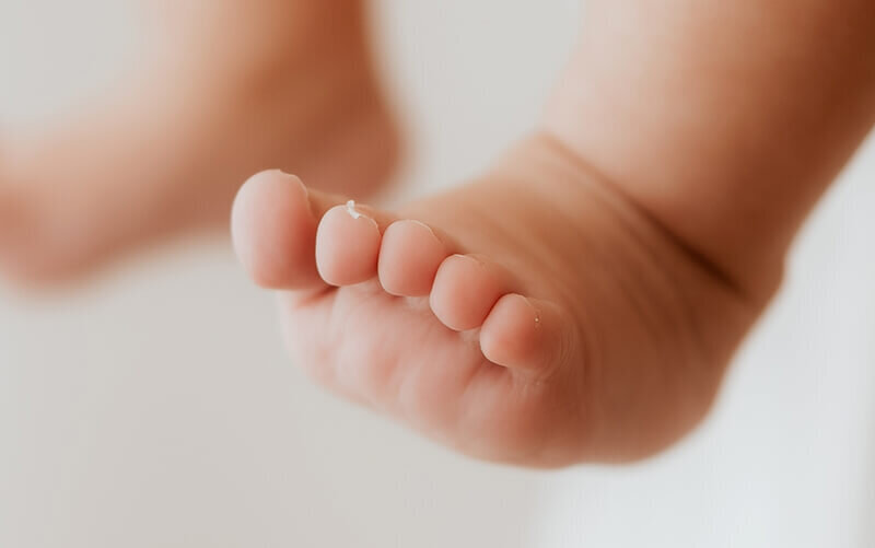 close up of newborn baby toes