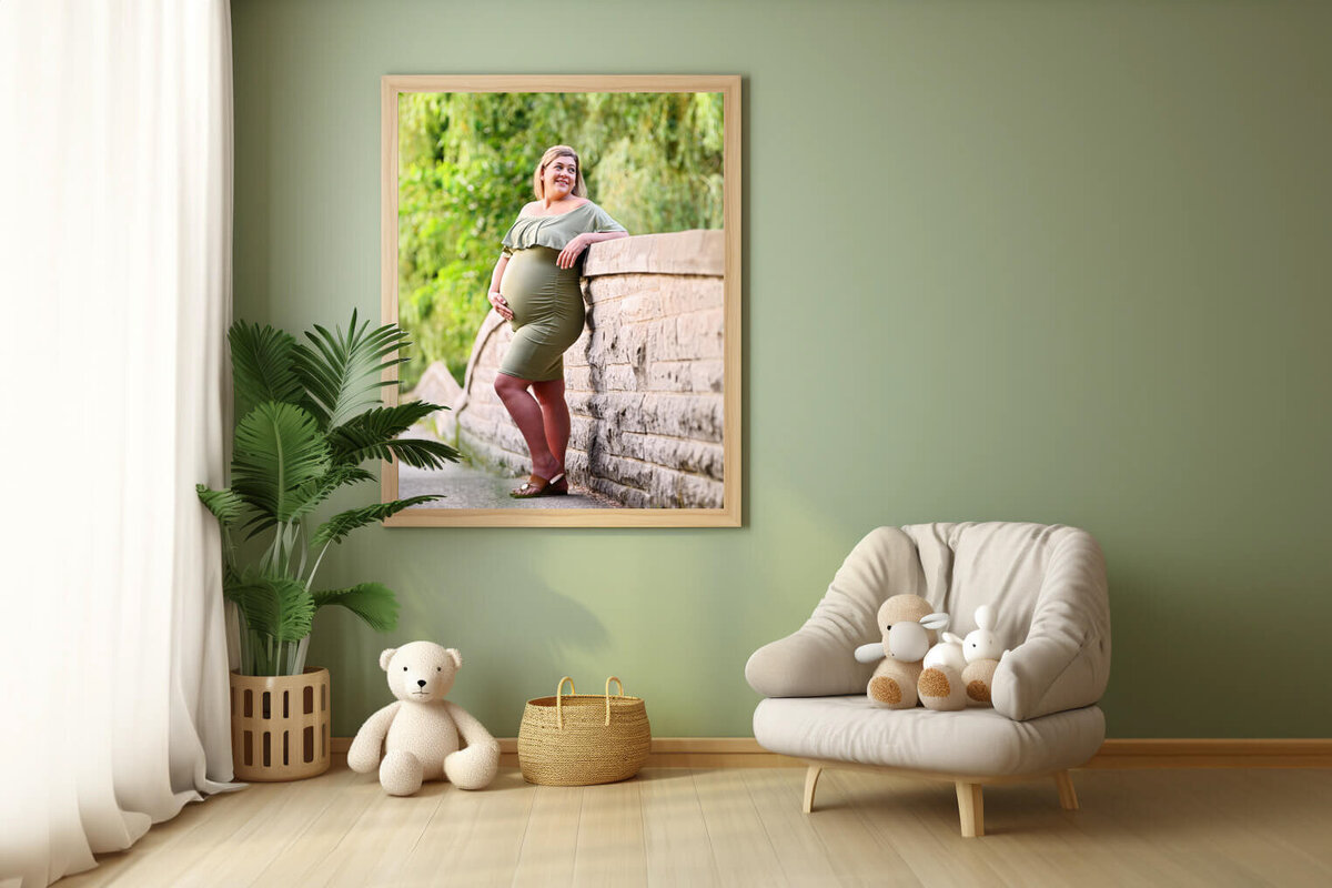 pregnant woman wearing green in a framed photo from her outdoor maternity photography session in Burlington