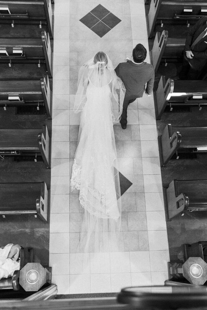 brother walking bride down the aisle near omaha