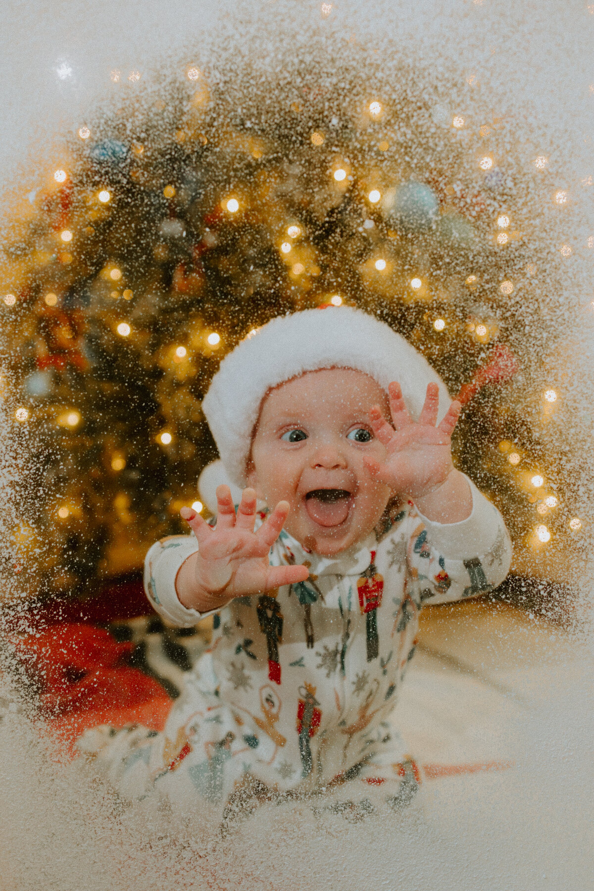 A baby presses her face against a snow frosted window at a photography mini session in Santa Fe