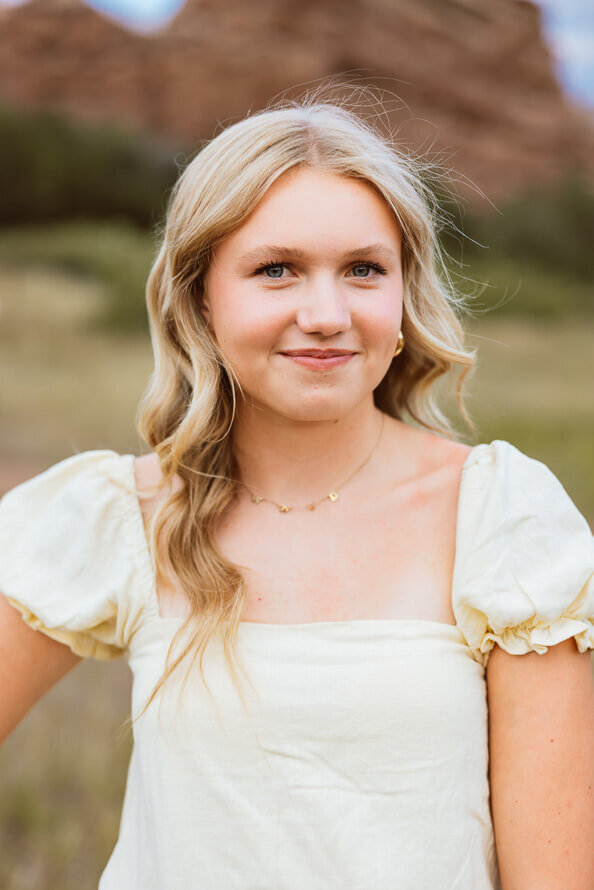 Close up of girl smiling at camera.