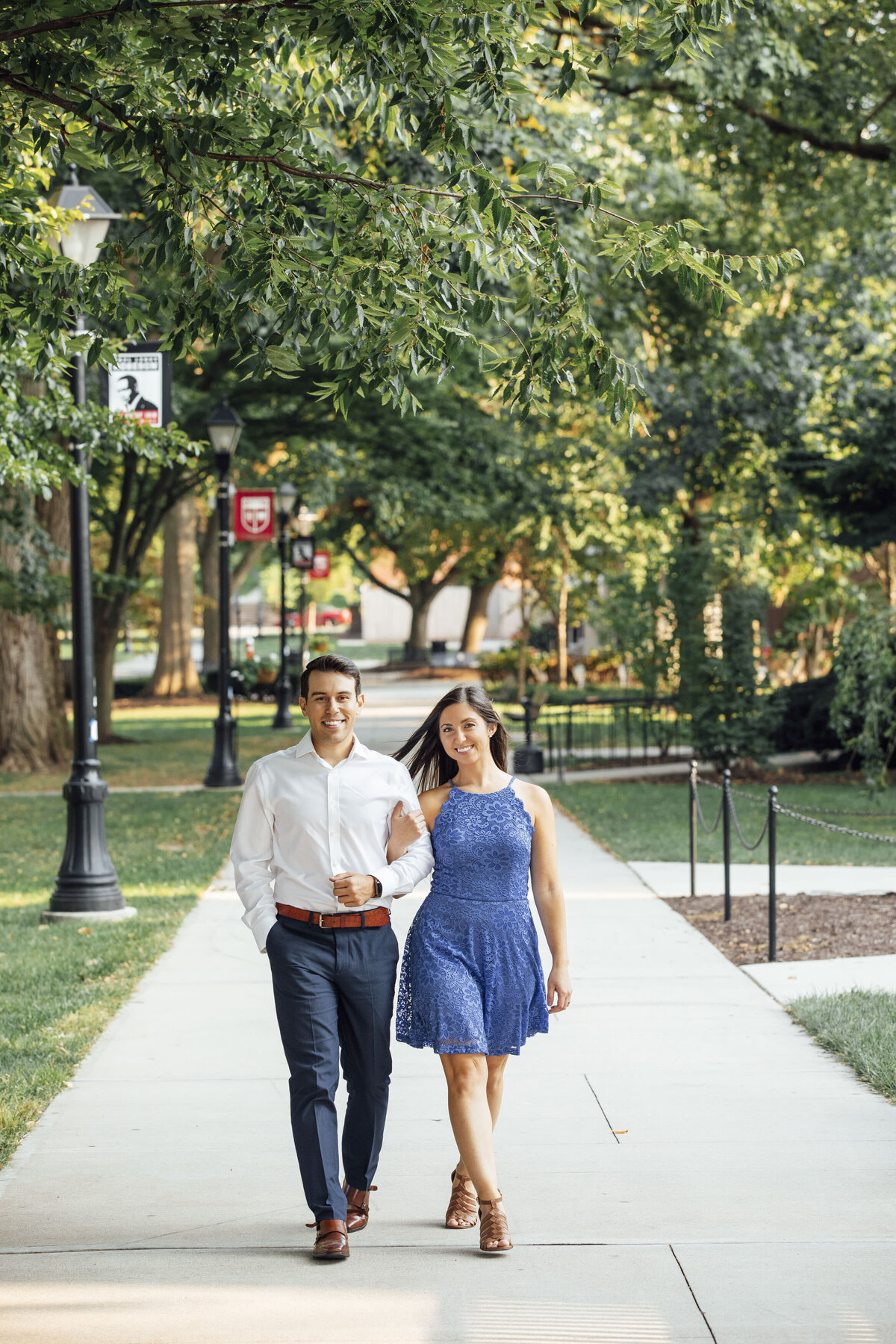 Couple strolling during engagement photo at Rutgers campus in New Brunswick New Jersey